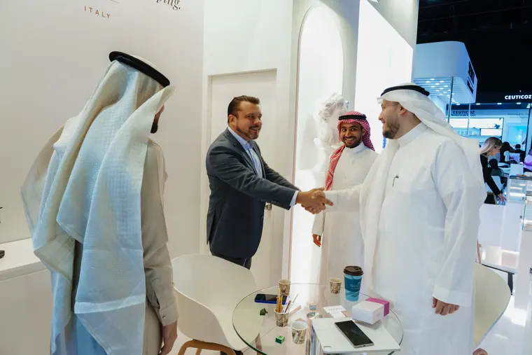 A handshake at the stand